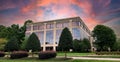 Generic Commercial Office Building with dramatic skies and space for copy.