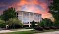 Generic Commercial Office Building with dramatic skies and space for copy.