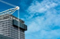 Building of office near construction site and blue sky and white clouds. Business tower building of company Royalty Free Stock Photo