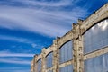 Building of the old abandoned production hall with windows closed with plastic sheets Royalty Free Stock Photo