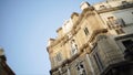 Building with old architecture and statues on sky background. Action. Old city building with antique European style Royalty Free Stock Photo