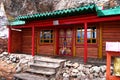 Building with painted traditional buddhist symbols red door in Tovkhon Monastery, Ovorkhangai Province, Mongolia. Royalty Free Stock Photo