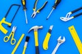 Building, painting and repair tools for house constructor work place set blue background top view pattern Royalty Free Stock Photo