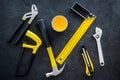 Building, painting and repair tools for house constructor work place set dark background top view pattern Royalty Free Stock Photo