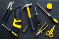 Building, painting and repair tools for house constructor work place set dark background top view pattern Royalty Free Stock Photo