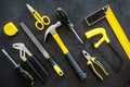 Building, painting and repair tools for house constructor work place set dark background top view pattern Royalty Free Stock Photo