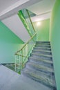 Building panel house interior with flight stairs and green walls. Precast concrete staircase. Flight of stairs. Flight