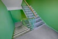 Building panel house interior with flight stairs and green walls. Precast concrete staircase. Flight of stairs. Flight
