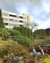 Building and park in springtime with water and trees