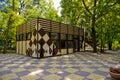 The building in the park is stylized under a chessboard and decorated with chess pieces. Royalty Free Stock Photo