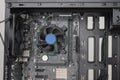 Building of PC, ATX motherboard inserted to black computer midi