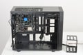 Building of PC, ATX motherboard inserted to black computer midi