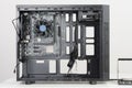 Building of PC, ATX motherboard inserted to black computer midi