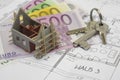 Building plan with keys and money Royalty Free Stock Photo