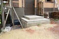 Building poured concrete front porch steps to the entrance door of a brick house under construction Royalty Free Stock Photo