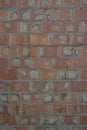 Building red embossed brick, building brick wall, structural background. Royalty Free Stock Photo