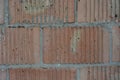 Building red embossed brick, building brick wall, structural background. Royalty Free Stock Photo