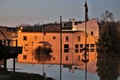 Building reflection in sunset in flood waters in Aurora, Indiana at evening. Royalty Free Stock Photo