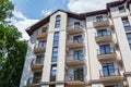 Building of a residential multi-storey building with a balcony close-up.