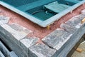 Building a rock encased spa and hot tub Royalty Free Stock Photo