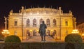 Building of Rudolfinum with statue of composer Antonin Dvorak from back. Night shot. Famous concert hall and home of the