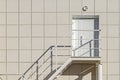 Building's Facade. The Walls Of The Cladding Aluminum Composite Panel With A Ladder And a Plastic Door.