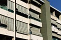 Building with a series of balconies with striped awnings Italy, Europe Royalty Free Stock Photo