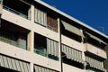 Building with a series of balconies with striped awnings Italy, Europe Royalty Free Stock Photo