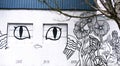 Building Side Mural with Eyes and Flowers Stencils