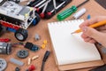 Building a simple car robot with microcontroller and notebook. Royalty Free Stock Photo