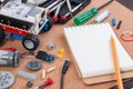 Building a simple car robot with microcontroller and notebook. Royalty Free Stock Photo