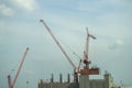 Building site with cranes and blue sky Royalty Free Stock Photo