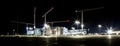 Building site with cranes by night Royalty Free Stock Photo