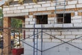 Building site of a house under construction. Unfinished house walls made from white aerated autoclaved concrete blocks. Wooden Royalty Free Stock Photo