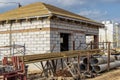 Building site of a house under construction. Unfinished house walls made from white aerated autoclaved concrete blocks. Wooden Royalty Free Stock Photo