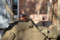 Building site: trowel, bricks and mortar for brickwork, part of a renovation of an Edwardian suburban house in north London, UK