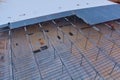 In the building site of the warehouse under construction, a metal frame steel framework is being used for the roof Royalty Free Stock Photo