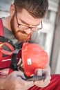 Building site worker on the scaffolding using mobile phone Royalty Free Stock Photo