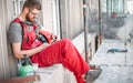 Building site worker on the scaffolding using mobile phone Royalty Free Stock Photo