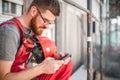 Building site worker on the scaffolding using mobile phone Royalty Free Stock Photo