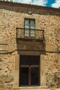 Building stone facade with door entrance and balcony at Caceres Royalty Free Stock Photo