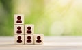 Building a strong team, Wooden blocks with people icon, Human resources and management concept. Leadership and corporate hierarchy Royalty Free Stock Photo