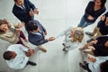 Building a successful business network together. High angle shot of two businesspeople shaking hands surrounded by