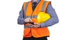 Building Surveyor in orange visibility vest using his smartphone Royalty Free Stock Photo