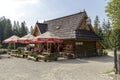 Building with tables and umbrellas in Zakopane