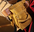 Building tool bag belt. Yellow tool bag. Leather bag Royalty Free Stock Photo