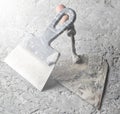 Building tools on a gray concrete background. Spatula Royalty Free Stock Photo