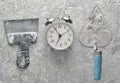 Building tools on a gray concrete background. Spatula, trowel, alarm clock, top view. Royalty Free Stock Photo