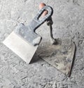 Building tools on a gray concrete background. Spatula, trowel. Royalty Free Stock Photo