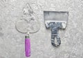 Building tools on a gray concrete background. Spatula, trowel, top view. Royalty Free Stock Photo